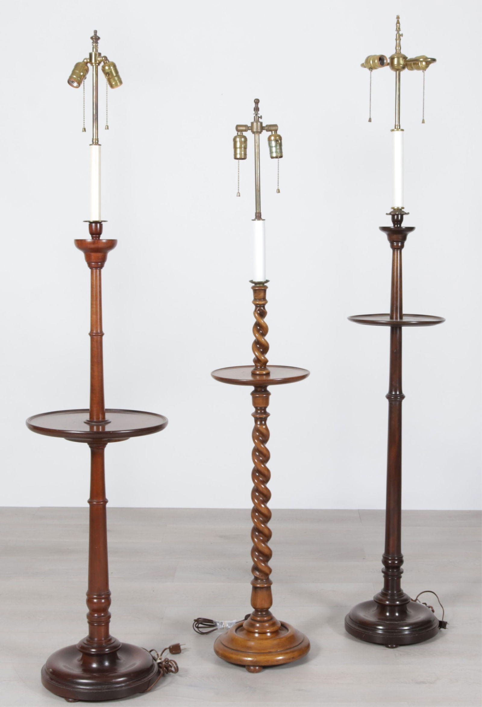 Three Georgian Style Mahogany Floor Lamps: Three Georgian Style Mahogany Floor Lamps, with trays, one barley twist Dimensions: Largest to the finial 64" H 