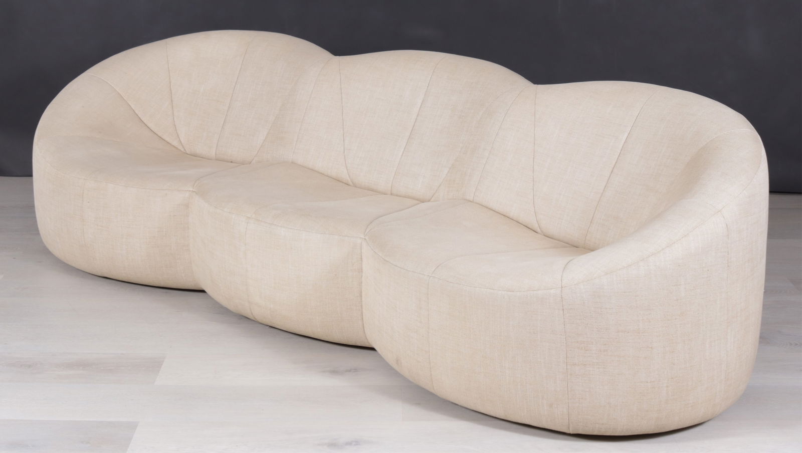 Pierre Paulin for Linge Roset Pumpkin Sofa: Pierre Paulin for Linge Roset Pumpkin Sofa, three seats upholstered in beige linen, circa 2008. Dimensions: 30" H x 96" W x 32" D
