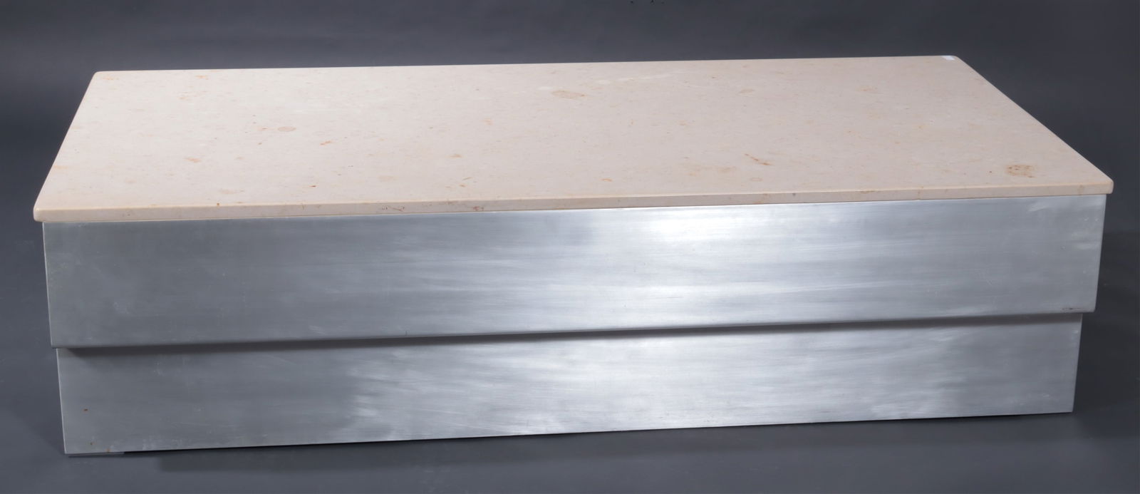 Modernist Aluminum Coffee Table: Modernist Aluminum Coffee Table, cream marble top.Provenance: Purchased Barton's, Lot 243, Sale 19 Dimensions: 15.5" H x 30" W x 60" L From a Washington Connecticut Home
