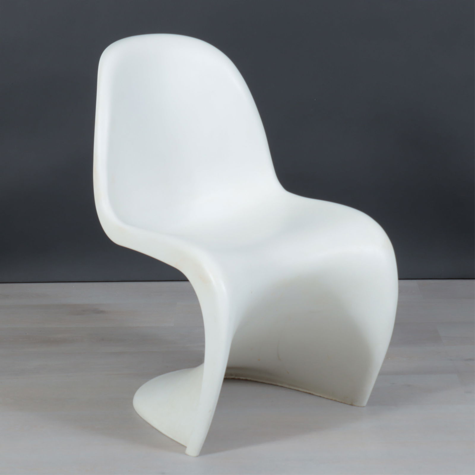 Verner Panton Chair by Vitra: Verner Panton Chair by Vitra, in white polypropylene, the original label underneath. Dimensions: 32" OH x 19 1/4" W x approx 24" D 