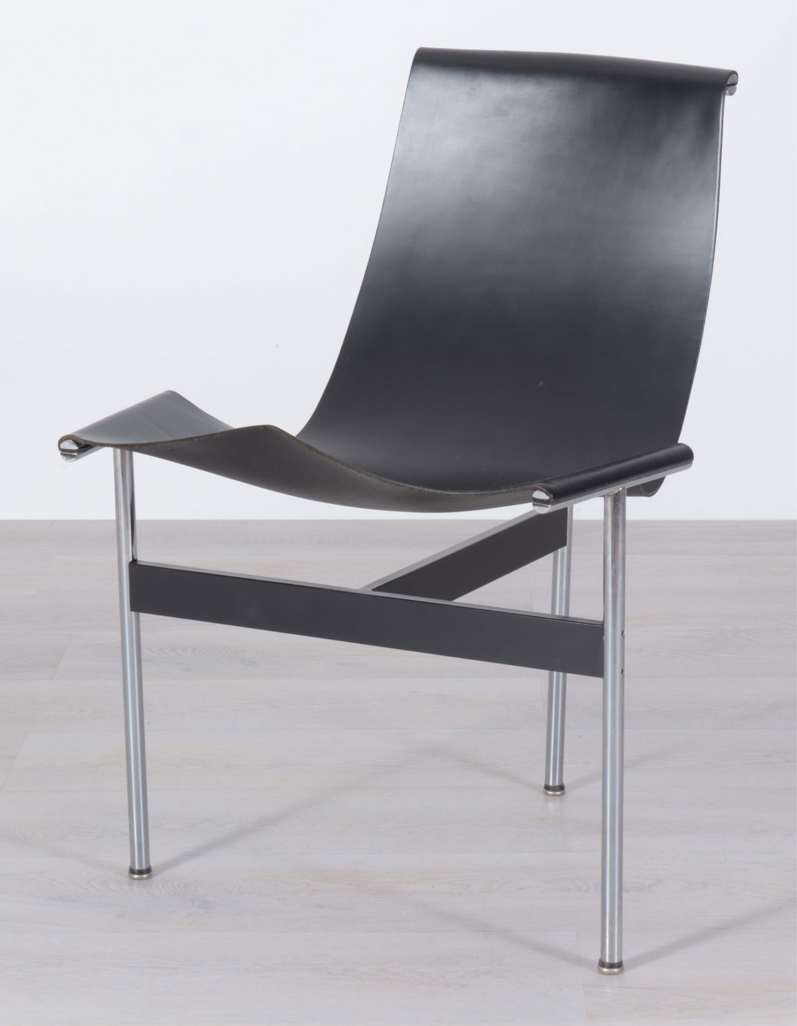 Katavolos Littell & Kelley for Laverne - T-Chair: Katavolos Littell & Kelley T-Chair for Laverne Int., in black leather upholstery. Provenance: Purchased Bonham's Skinner Sale 28628, Lot 299. Dimensions: 32" H x 23" W x 22" D From a Washington