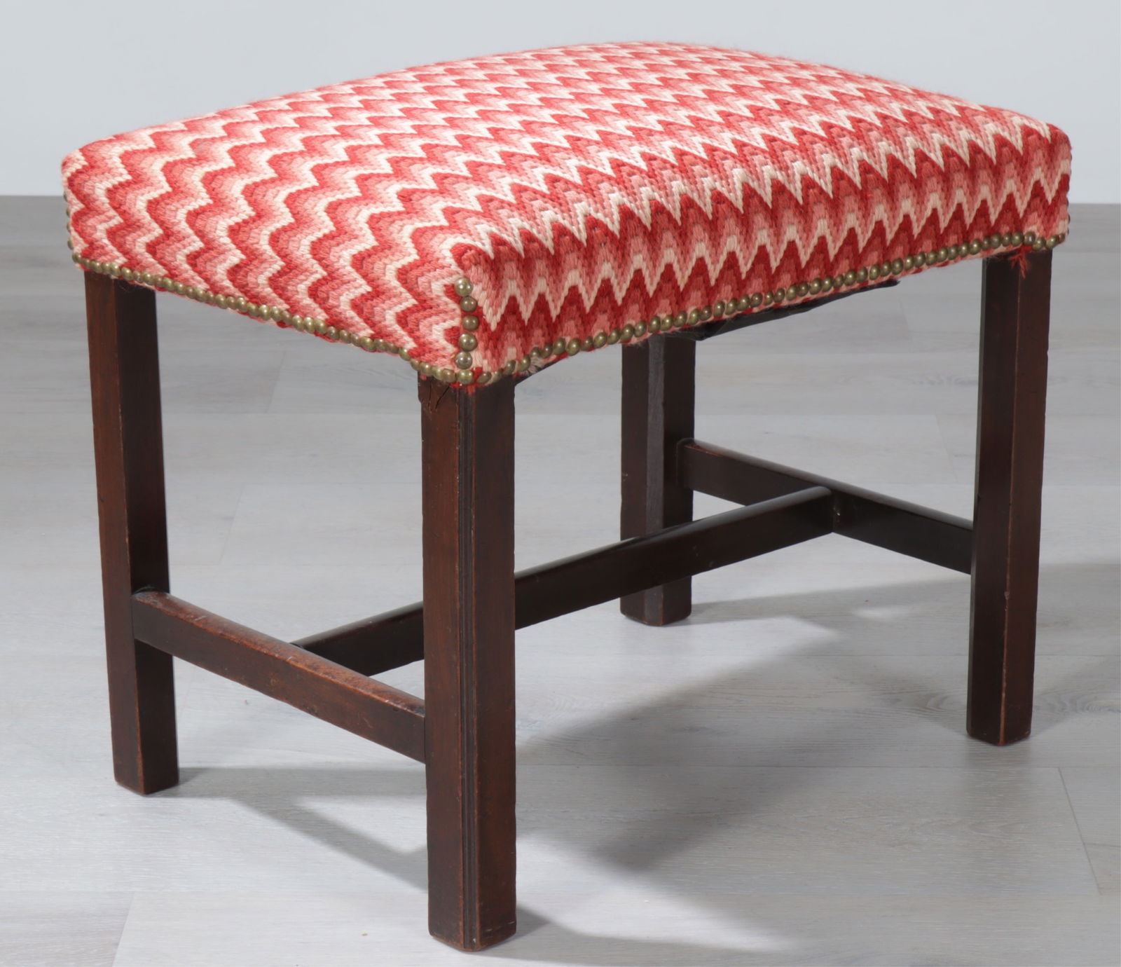 George III Mahogany Bench, 18th C.: George III Mahogany Bench, 18th C., with brass tacked red flame stitch upholstery. Dimensions: 17.75" H x 21.5" W x 16" D 