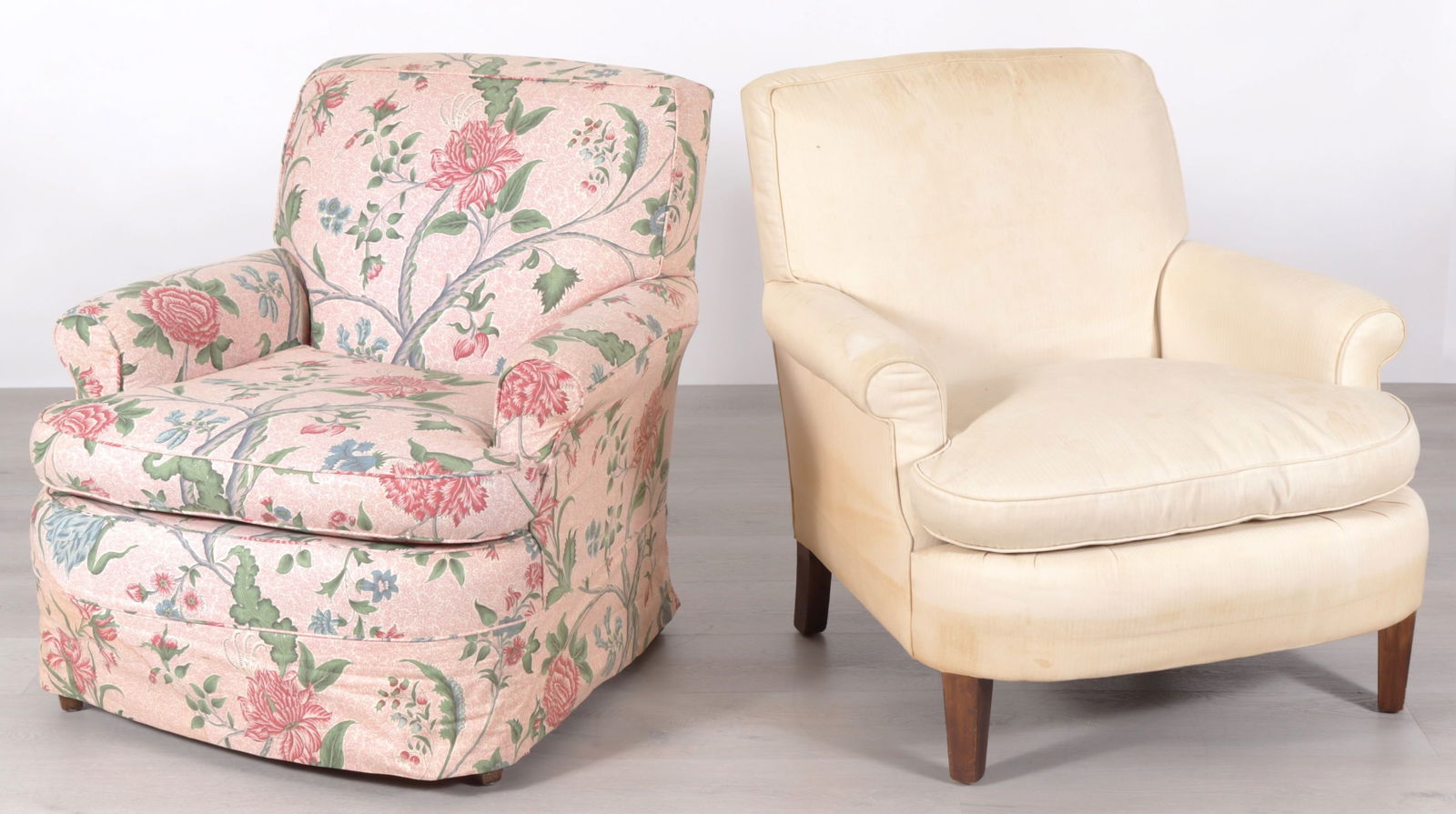 Pair DeAngelis Club Chairs: Pair DeAngelis Club Chairs, one in pink foliate cotton upholstery Dimensions: 32" H x 28" W x 30" D 