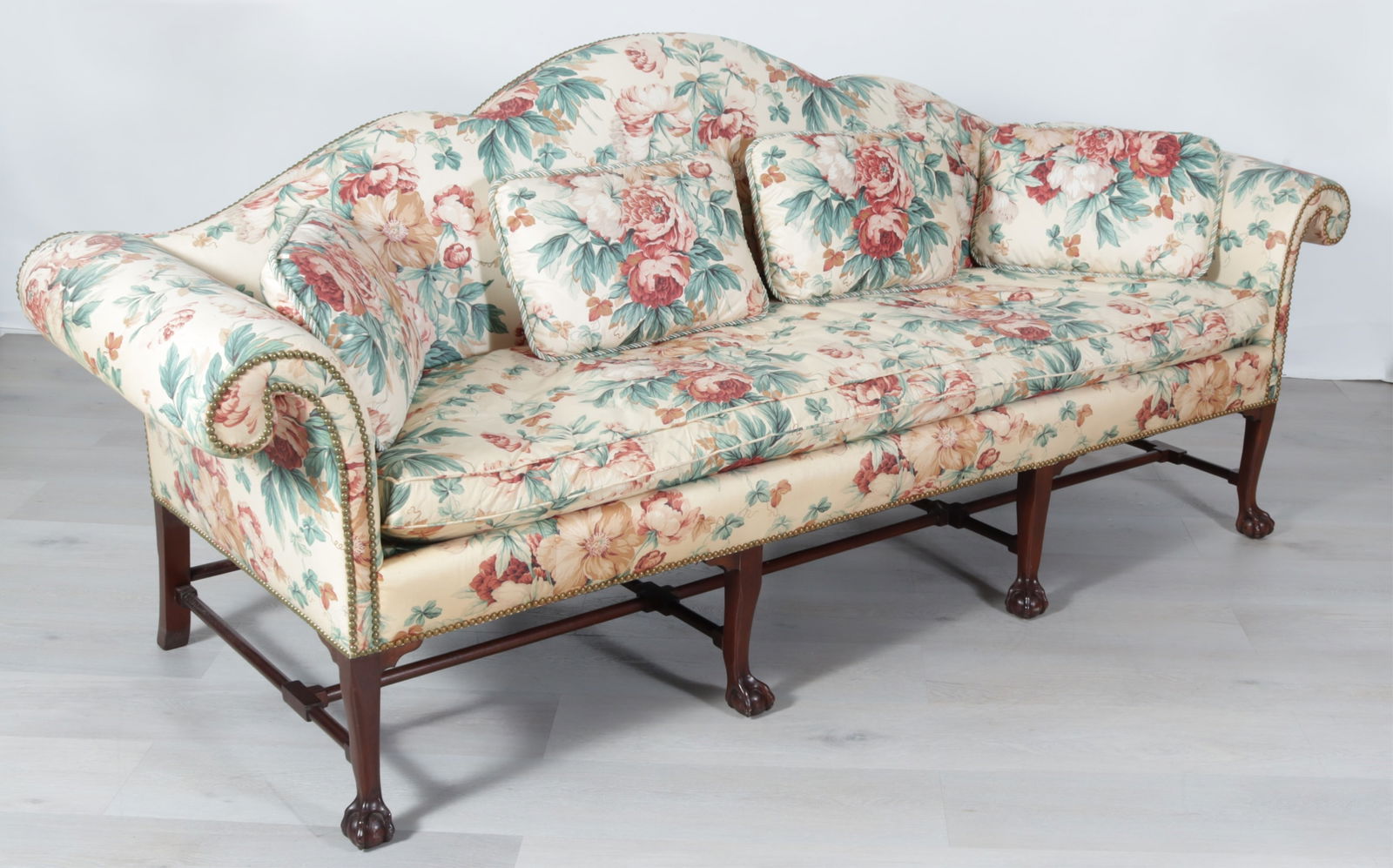 Kindel George III Style Mahogany Camelback Sofa: Kindel George III Style Mahogany Camelback Sofa, in foliate pink chintz upholstery Dimensions: 39" H x 92" W x 32" D