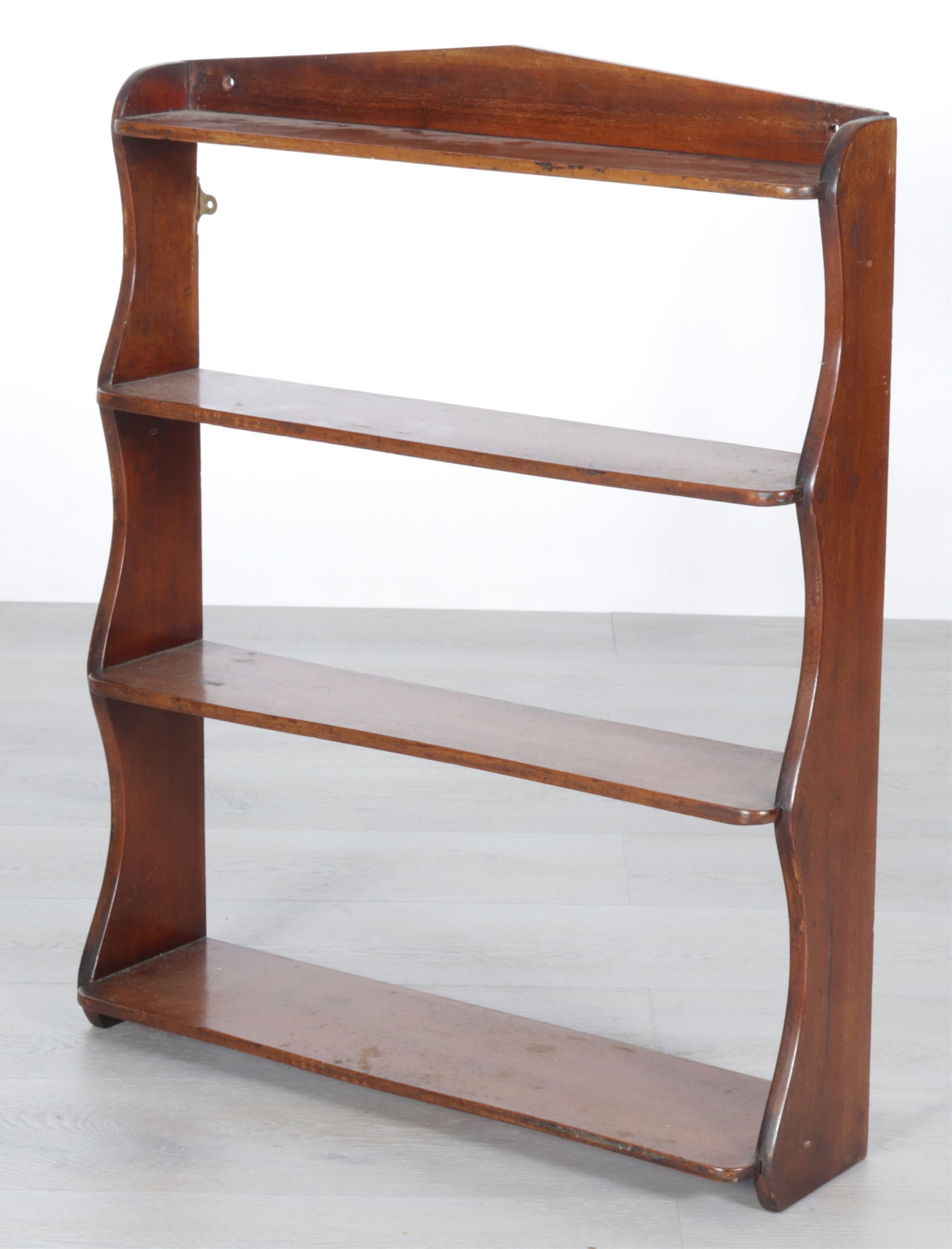 English Mahogany Hanging Open Bookshelf, 19th C.: English Mahogany Hanging Open Bookshelf, 19th C. Four shelves with shaped sides. Dimensions: 30" H x 25" W x 6.75" D 