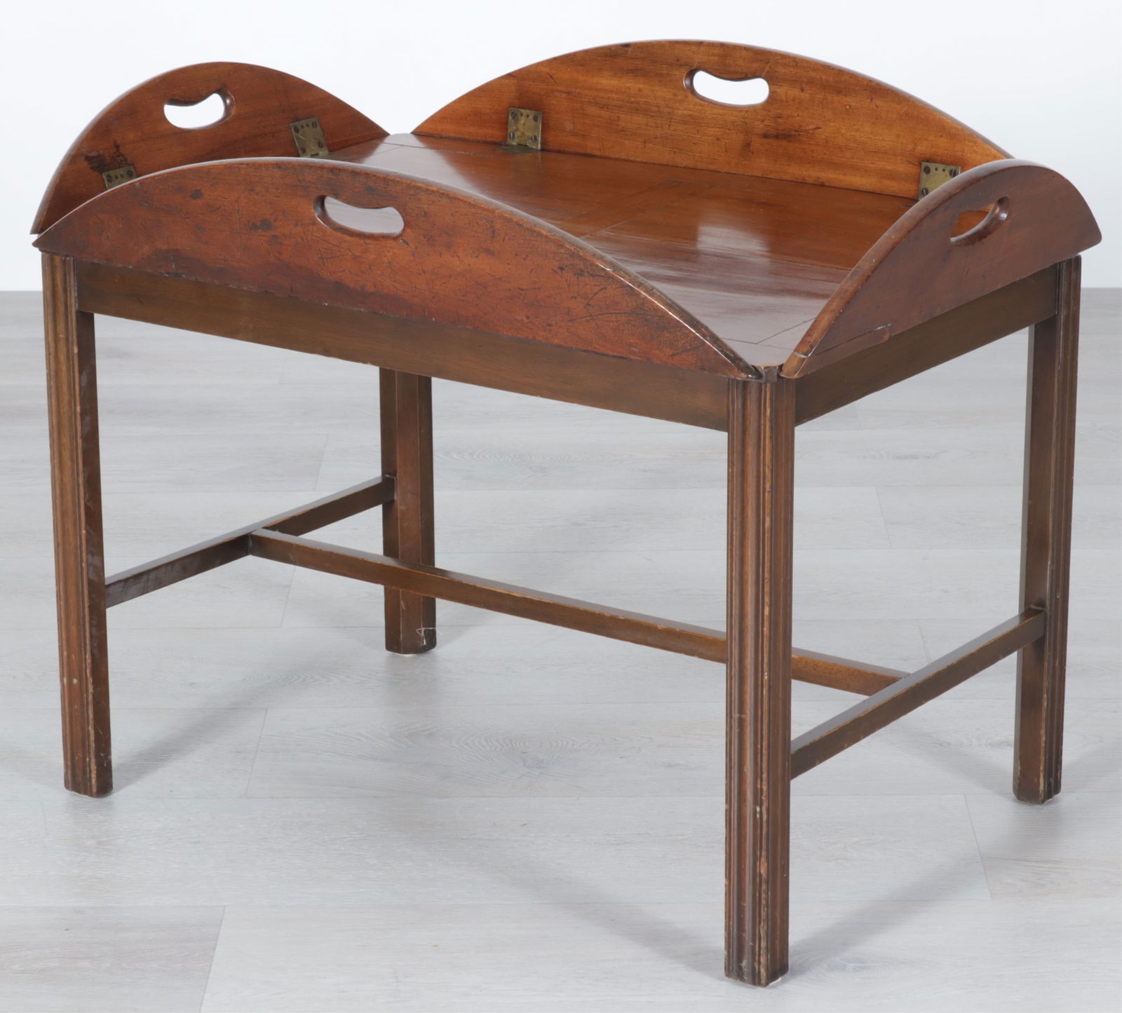 English Brass Mounted Mahogany Butler's Tray, 19C: English Brass Mounted Mahogany Butler's Tray on Stand, 19th C. Dimensions: 22.25" H x 29.25" W x 20.25" D 