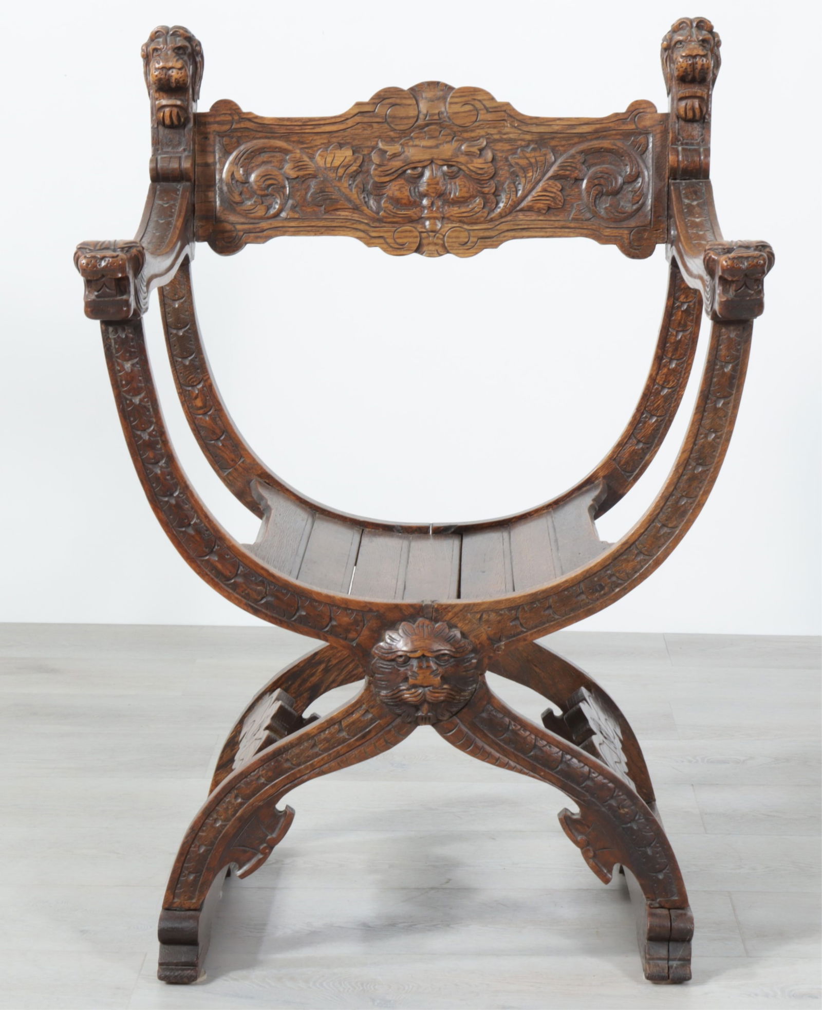 Baroque Revival Oak Savonarola Armchair: Baroque Revival Oak Savonarola Armchair, Late 19th/Early 20th C. Dimensions: 36.75" H x 26.5" W x 20.5" D 