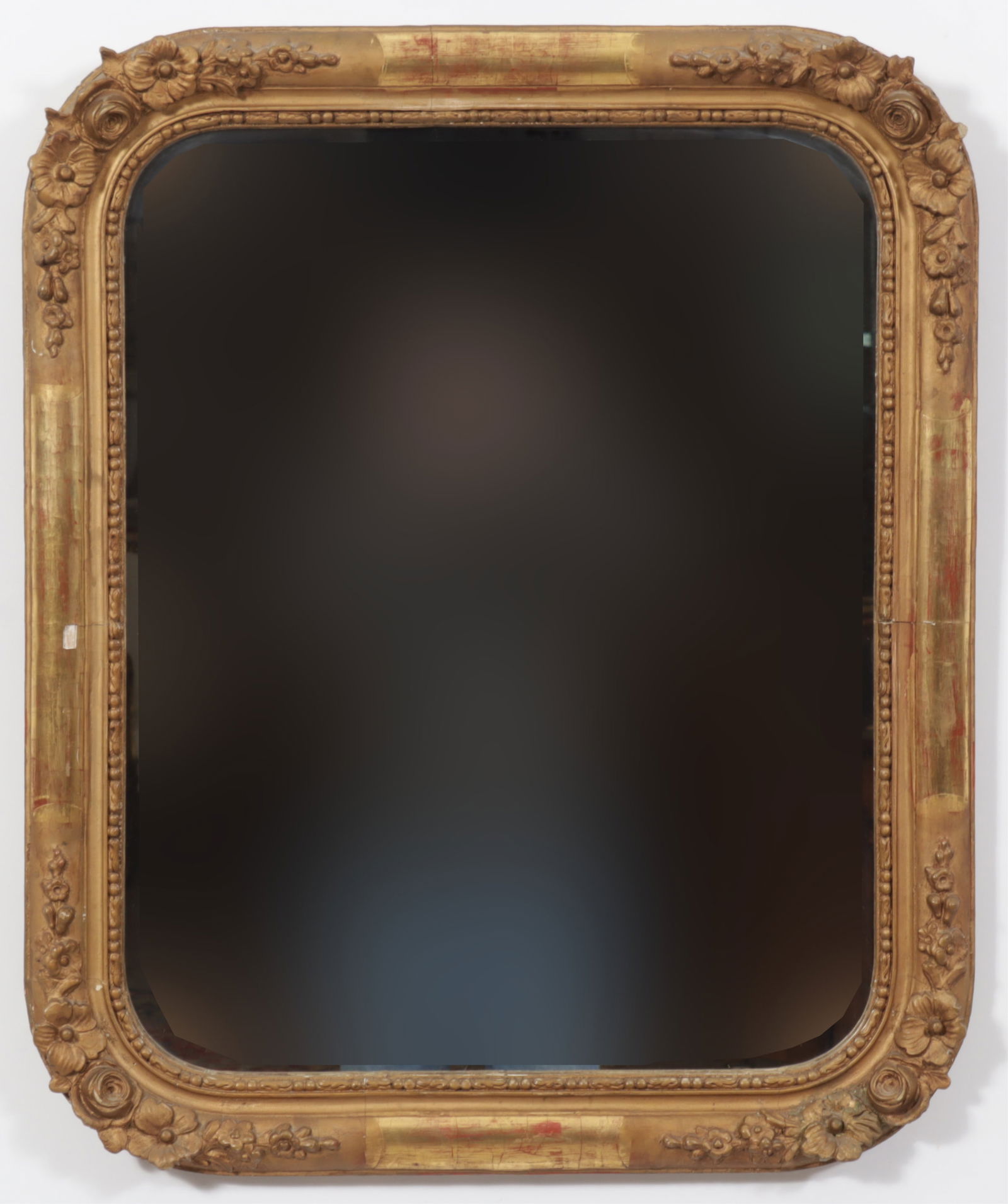 Giltwood and Composition Mirror, 20th C: Giltwood and Composition Mirror, 20th C. Rounded cornered with stylized flowers and roses, beaded moulding. Dimensions: 19 x 16" 