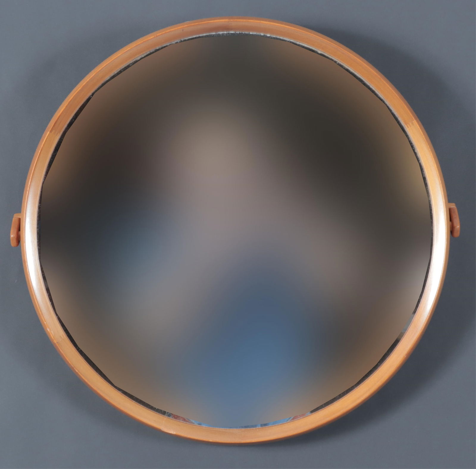 Danish MCM Teakwood Round Mirror: Danish Midcentury Modern teakwood mirror, unsigned, no label, with pivoting back mount. Dimensions: Front of frame: 17 1/4" x 17 1/4" 