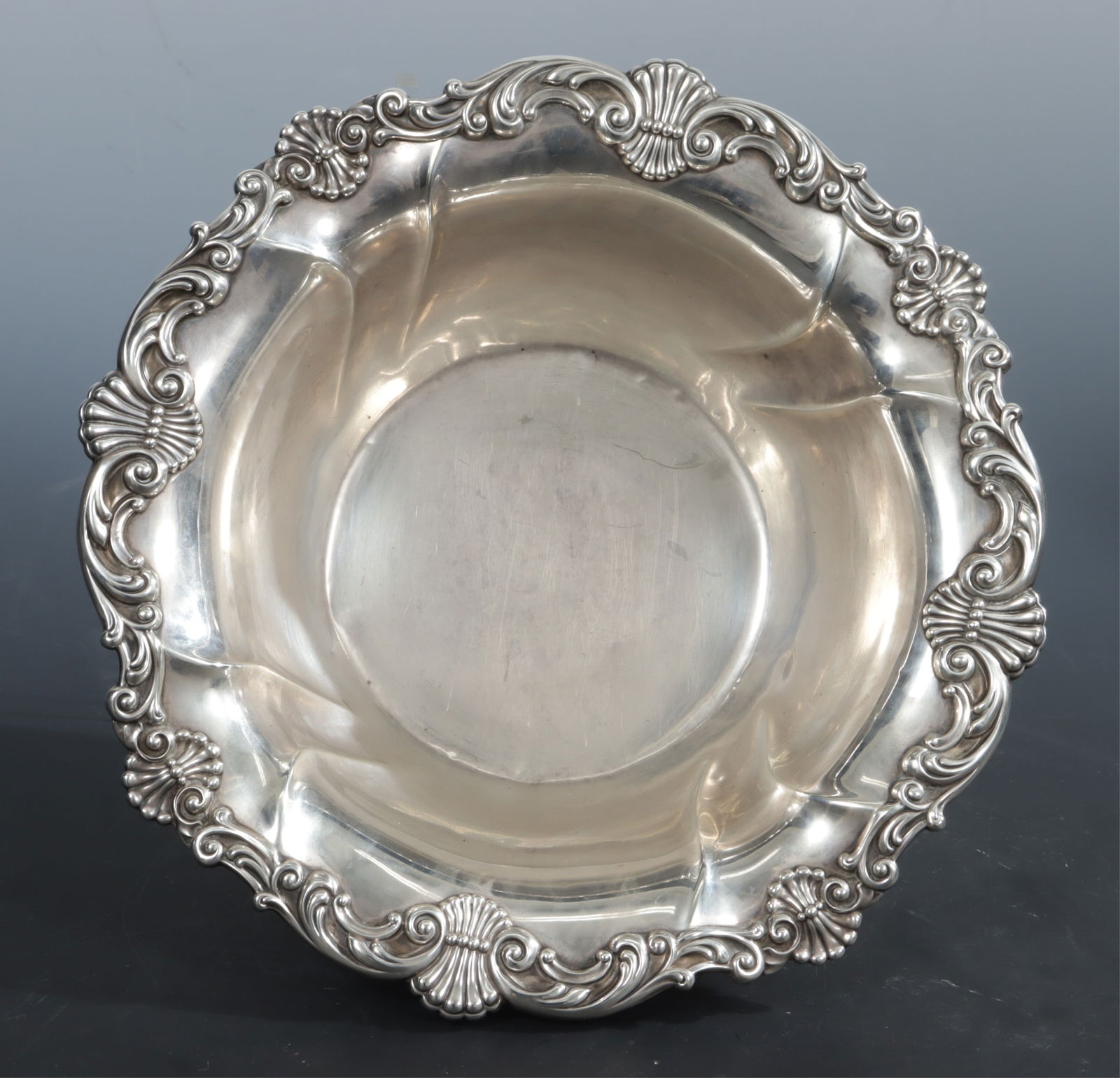 Gorham Sterling Silver Round Vegetable Bowl: A Gorham sterling silver vegetable bowl, pattern A2227, shell and scroll motif rim. 12.57 OZT. Dimensions: 3" H x 10.5" diameter