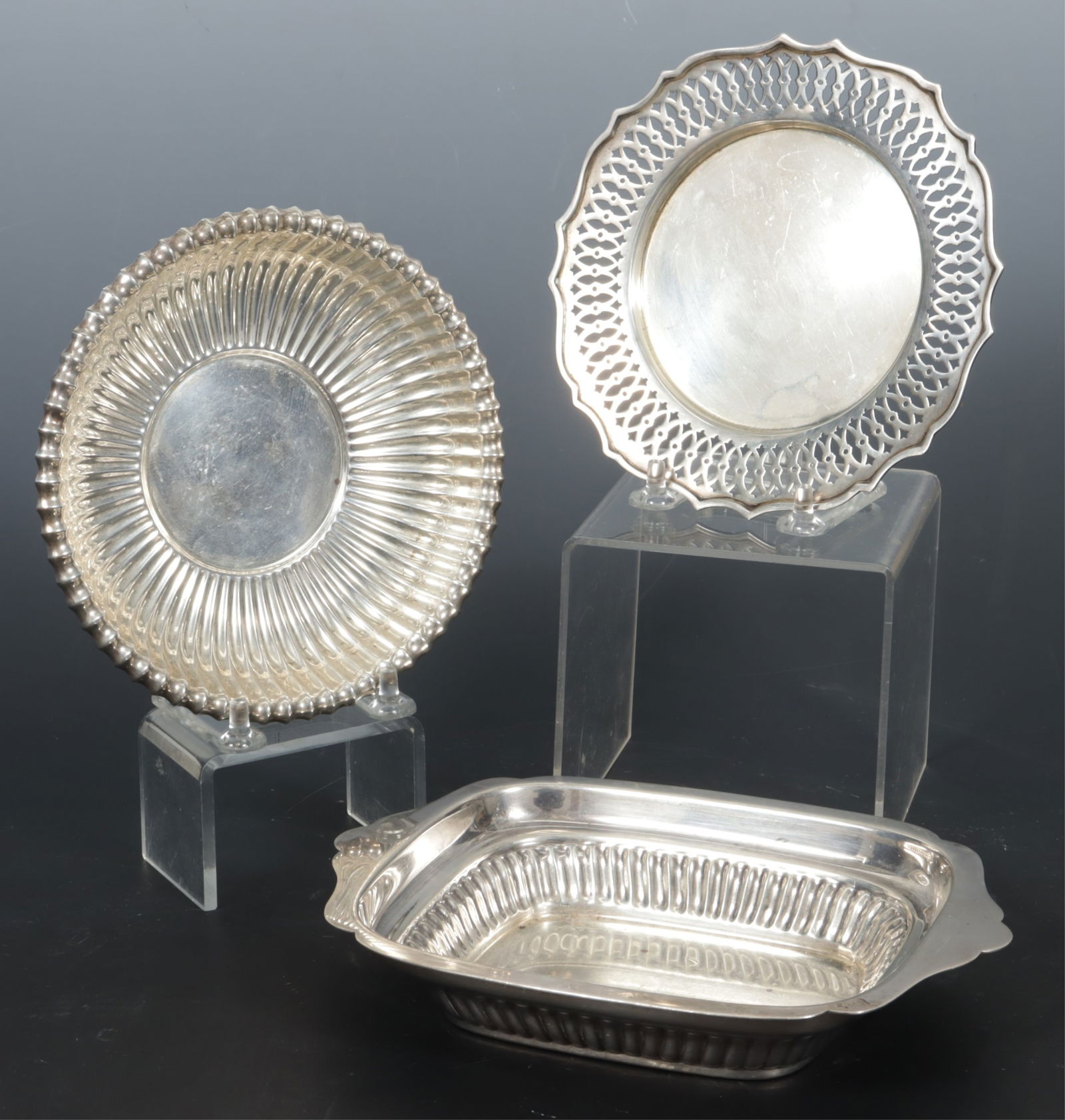 Three Gorham Sterling Silver Dishes: A group of three Gorham sterling silver dishes, 20th century. Comprising: Leamington pattern bon bon bowl, #42672, rectangular dish with fluted base and shaped flange handles #40618, Chippendale pierc