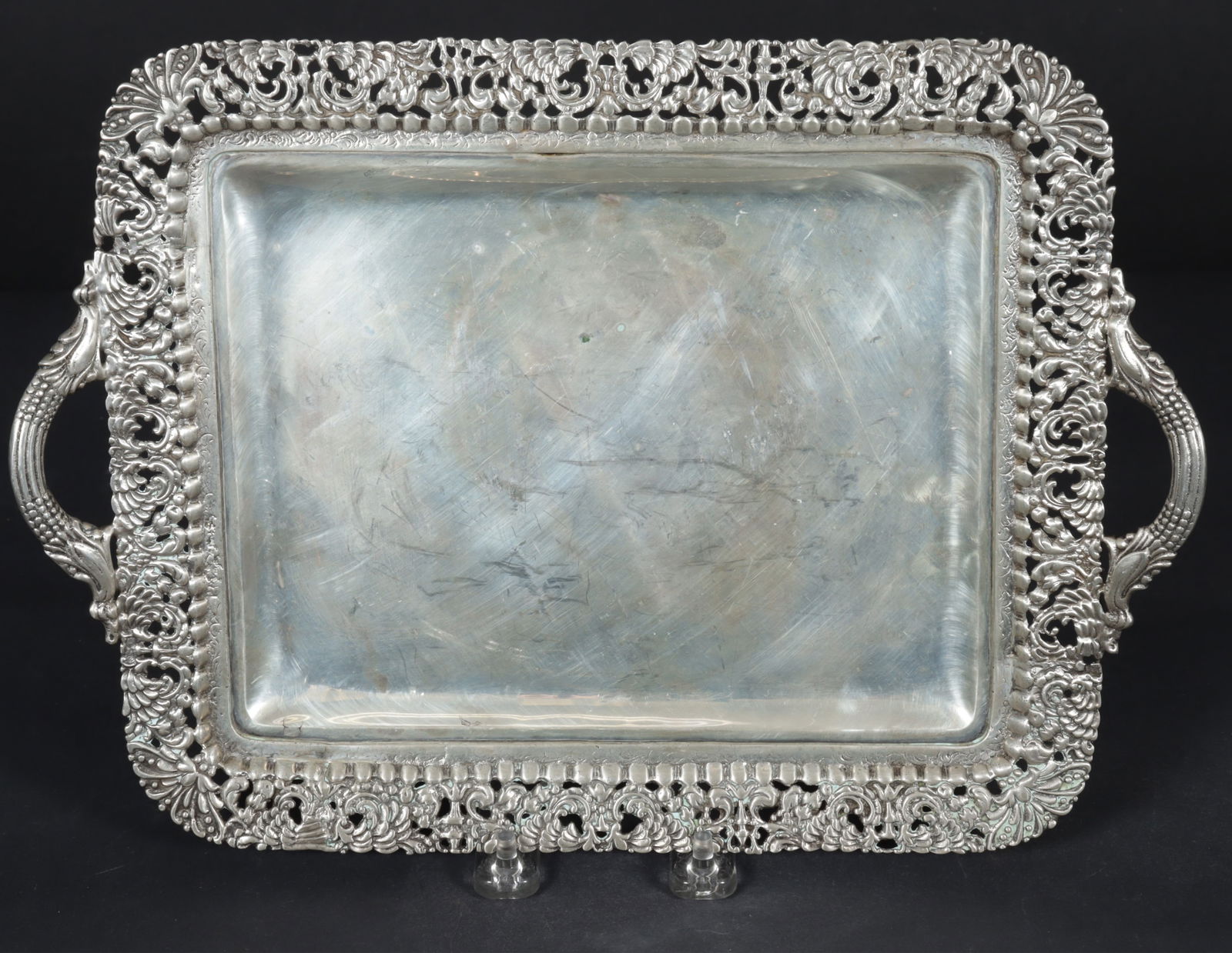 Sanborns Sterling Silver Tray: R. Sanchez for Sanborn, sterling silver tray with detailed pierced rim and two figural handles. Bottom stamped Hencho en Mexico R Sanchez Esterling 925, along with Sanborns Mexico Sterling. 22 OZT.