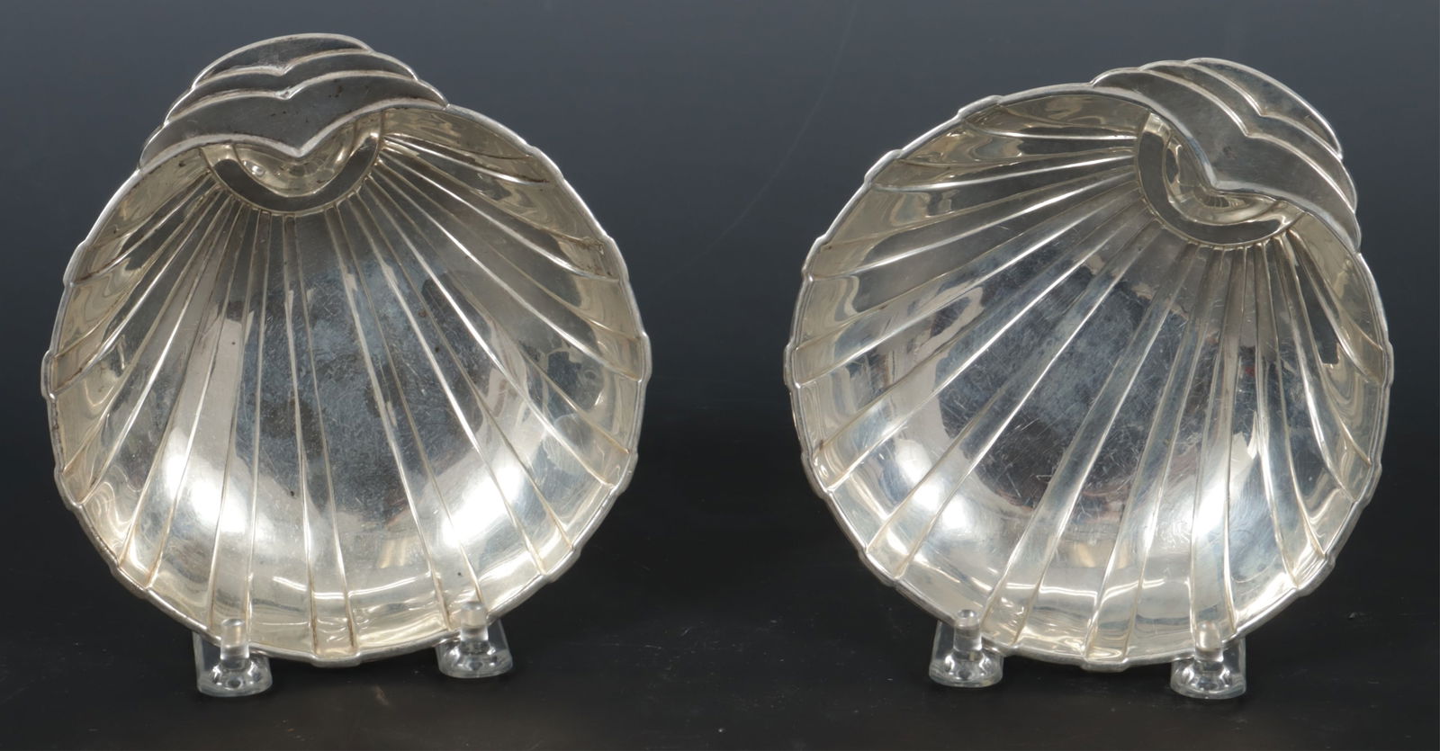 Pair of Concord Sterling Silver Shell Dishes: A pair of Concord Silver Co., New Hampshire, sterling silver shell form candy dishes. 5.31 OZT. Dimensions: 5 3/8" x 5" 