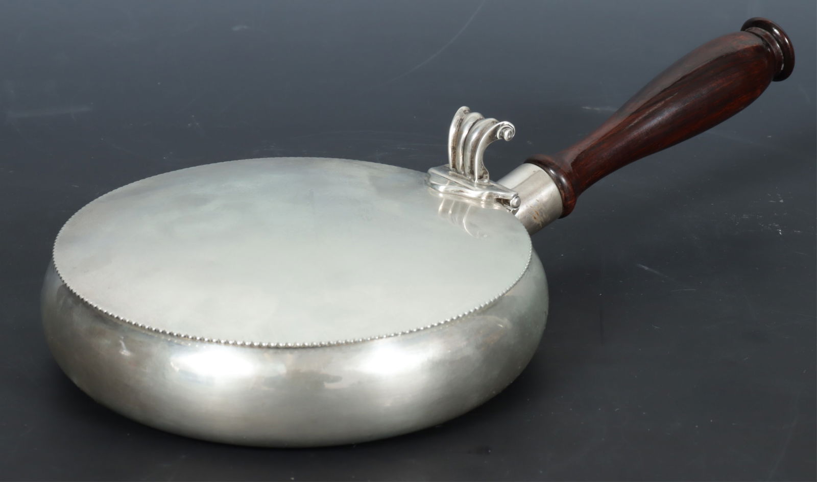 Sanborns Sterling Silver Bed Warmer: Sanborns Mexican sterling silver bed warmer with ebonized wooden handle. Gross weight of 19 OZT. Dimensions: 11.5" long including handle 