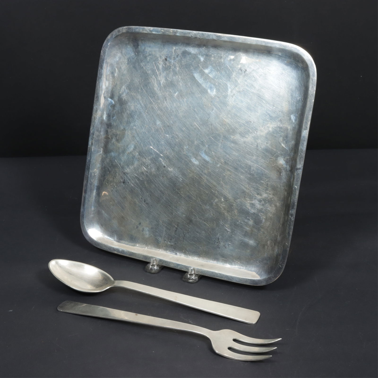 Sanborns Modernist Sterling Silver Serving Suite: Sanborns, Mexican sterling silver modernist form two-piece fork and spoon salad serving utensils with a square rounded corner tray. 37 OZT. Dimensions: Tray 12" x 12". Utensils 11" long. 