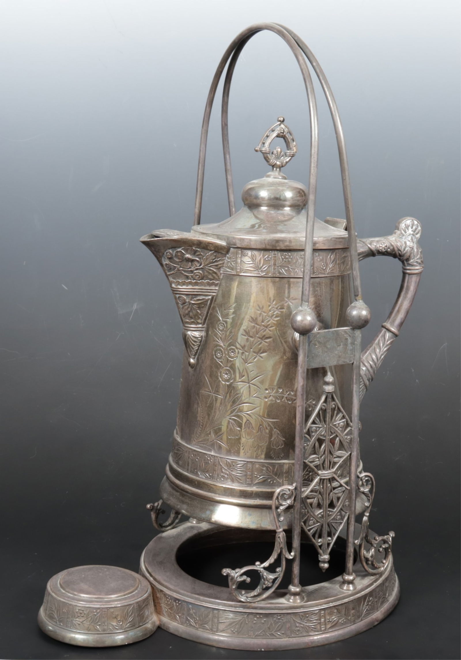 Pairpoint Aesthetic Silverplate Tilting Pitcher: Pairpoint Aesthetic Silverplate Tilting Pitcher on Stand, circa 1860 Dimensions: 19.5" H 