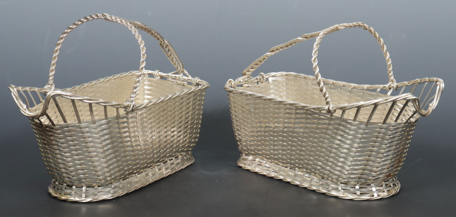 Pair Christofle Gallia Silverplate Wine Baskets: Pair Christofle Gallia Silverplate Wine Baskets, mid 20th C., each marked. Dimensions: 9.75" L