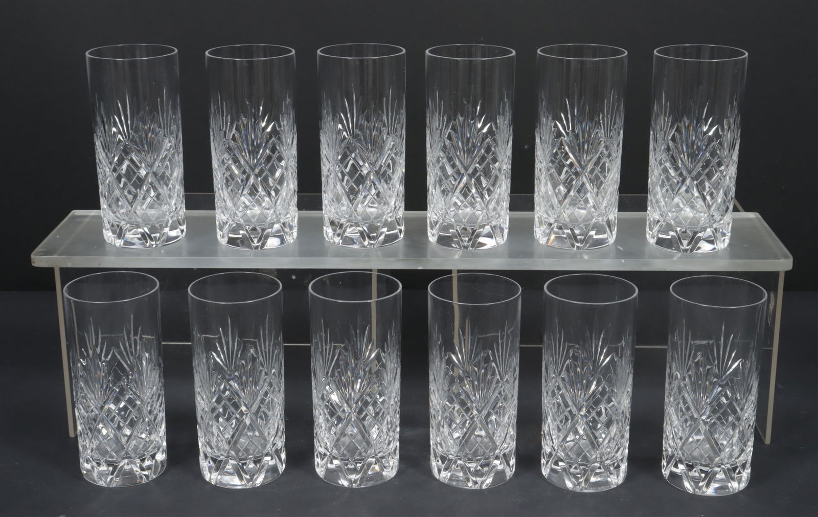 12 Da Vinci Firenze Highball Glasses: A group of 12 Da Vinci Firenze pattern highball glasses. Heavily weighted bottoms. Etched on Da Vinci on bottom. Dimensions: 6" H x 2.75" diameter 