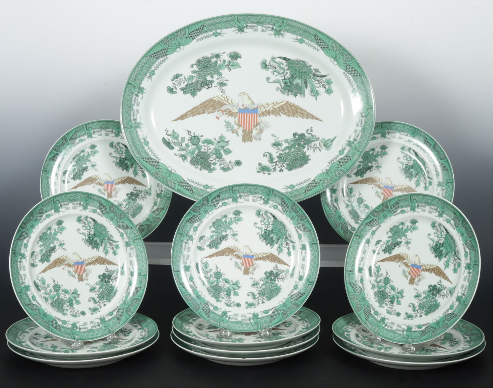 Mottahedeh Bicentennial Porcelain Plates, Platter: Twelve Mottahedeh Bicentennial Export Porcelain Plates and Platter, each decorated in the green Fitzhugh style, with American eagle and shield, in the pattern used for the Ronald Reagan Presidential C