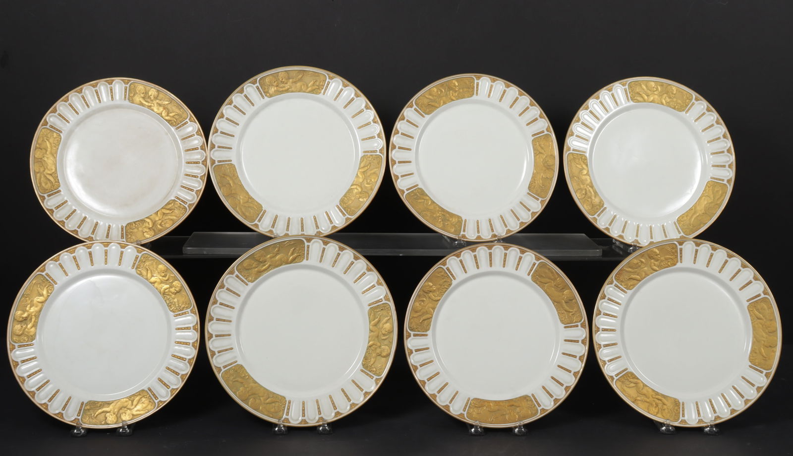 Eight KPM Gilt Porcelain Cherub Dinner Plates: Eight KPM Gilt Porcelain Cherub Dinner Plates, designed by Paul Schley. Dimensions: 9.75" diameter