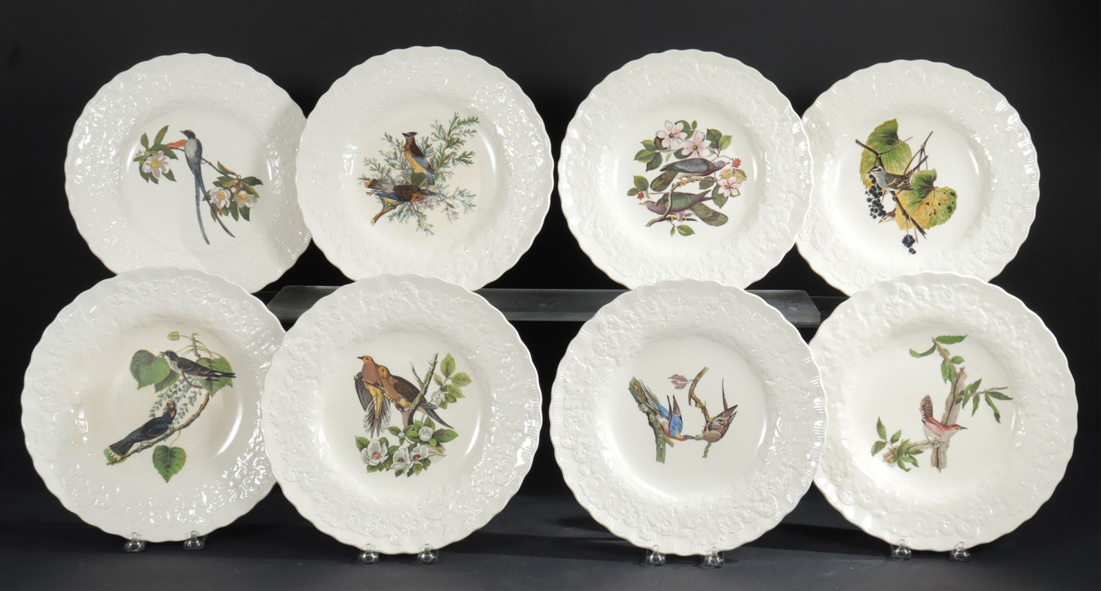 Alfred Meakin Birds of America Porcelain Plates: Alfred Meakin Ltd (1875-1976), group of eight Birds of America porcelain dinner plates with embossed rim. Plate numbers 17, 18, 43, 62, 114, 168, and 367. Dimensions: 11" diameter.