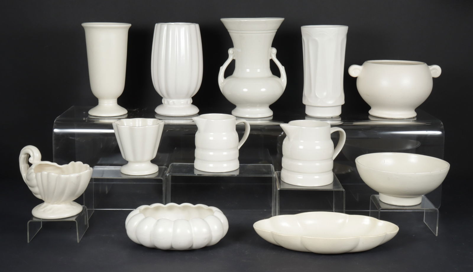 Mid-Century American Pottery: Mid-century modern American pottery grouping, including Heager, Hull, Redwing, etc. Dimensions: Tallest; 9.50" H