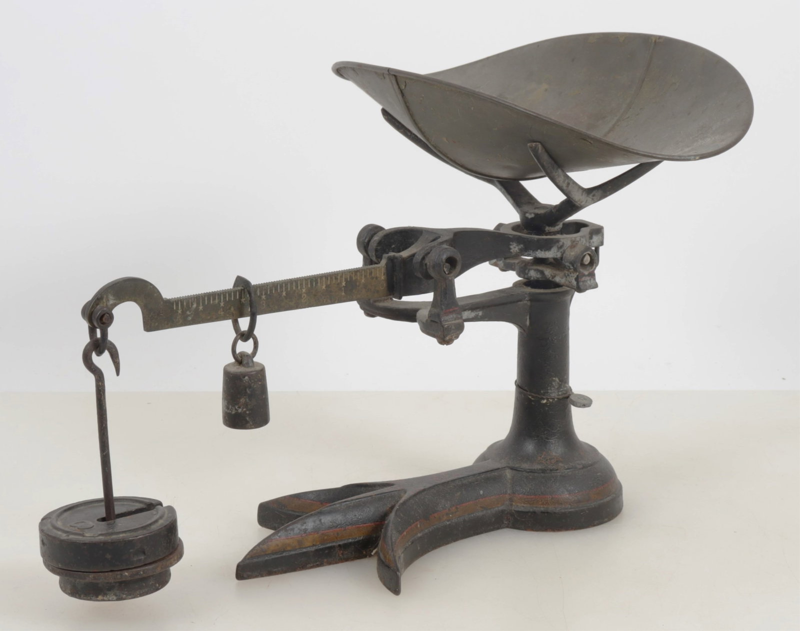 Painted Metal & Brass Scale, 20th c.: Early 20th century metal and brass scale with a Fleur de Lis shaped base. Dimensions: 11" H x 16" L Property from a lifetime collector