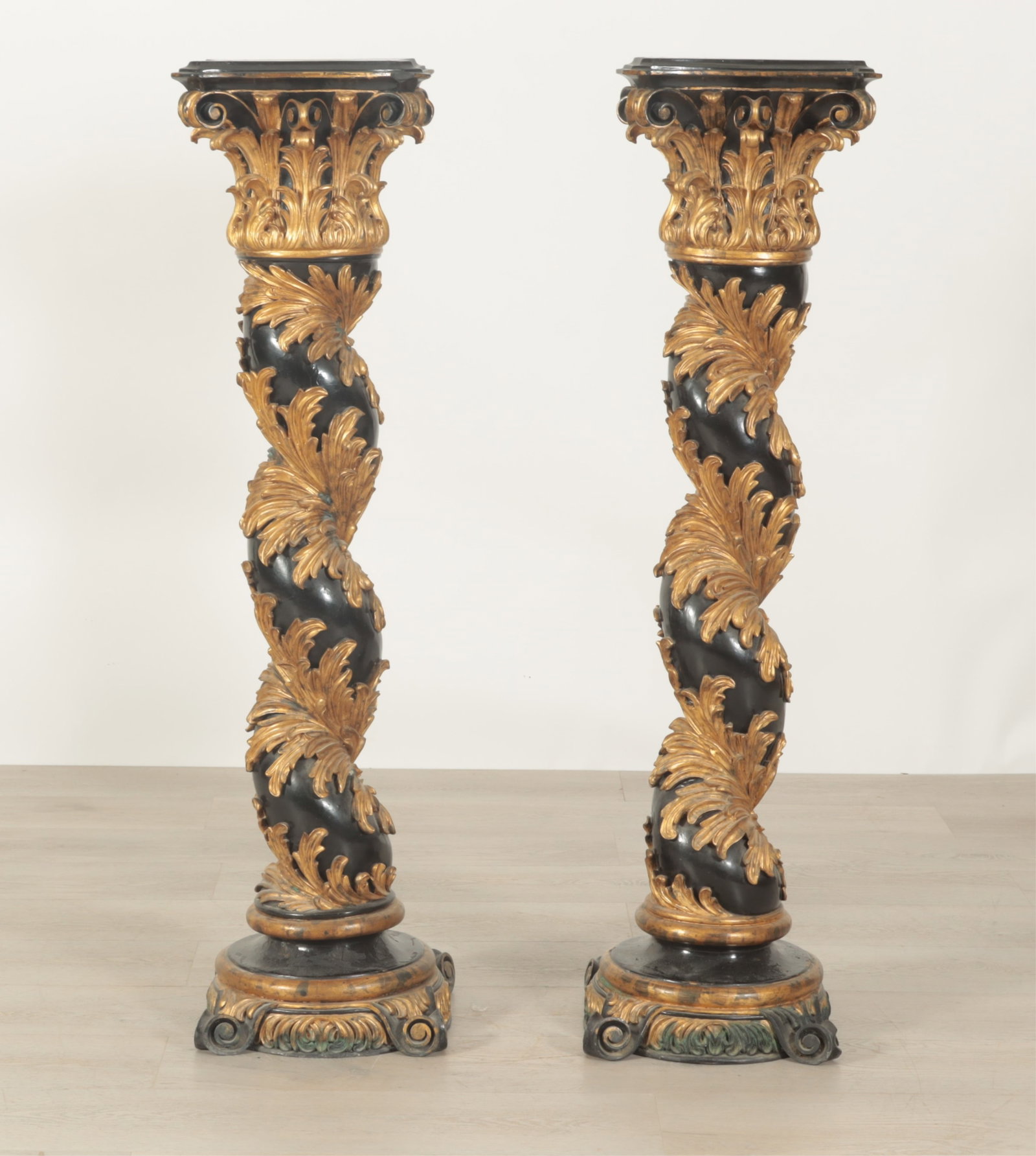 Pair Italian Baroque Style Solomonic Columns: Pair Italian Baroque style carved giltwood and black painted Solomonic columns Dimensions: 48.5" H x 12.25" Square Property from a Bronxville Estate.