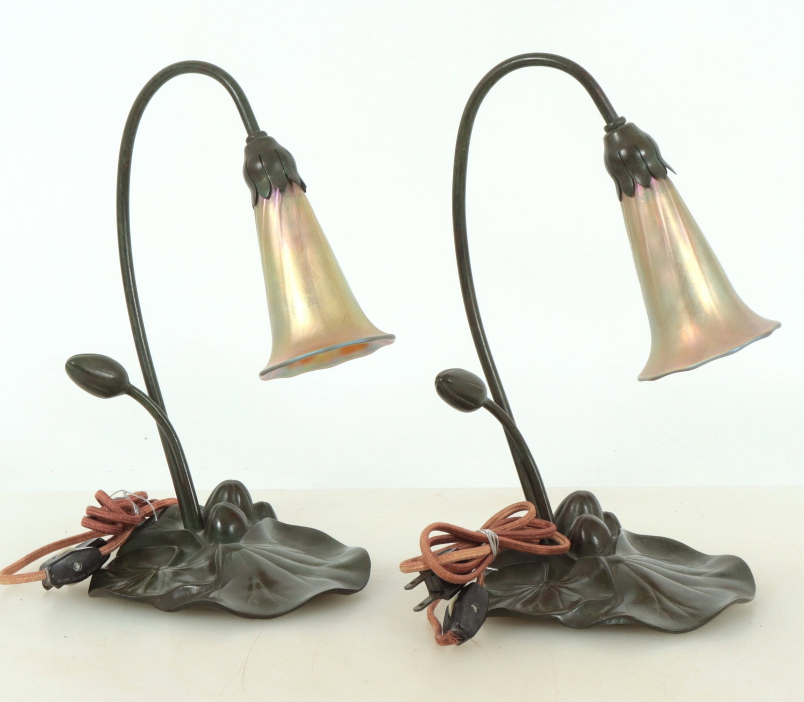 Pair Buffalo Studios Iridescent Glass Lily Lamps: Pair Buffalo Studios Iridescent Glass Lily Lamps, circa 1985, unsigned Dimensions: 11.5" H Property from a Mount Vernon, NY estate.