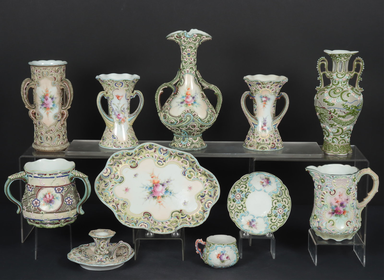 12 Moriage Satsuma Table Articles: Group of 12 Moriage Satsuma Table Articles, including teacup & saucers, 7 vases, pitcher, candlestick and tray Dimensions: Teapot; 11" H P,latter; 11" x 7.5" Property from a Mount Vernon, NY estate.