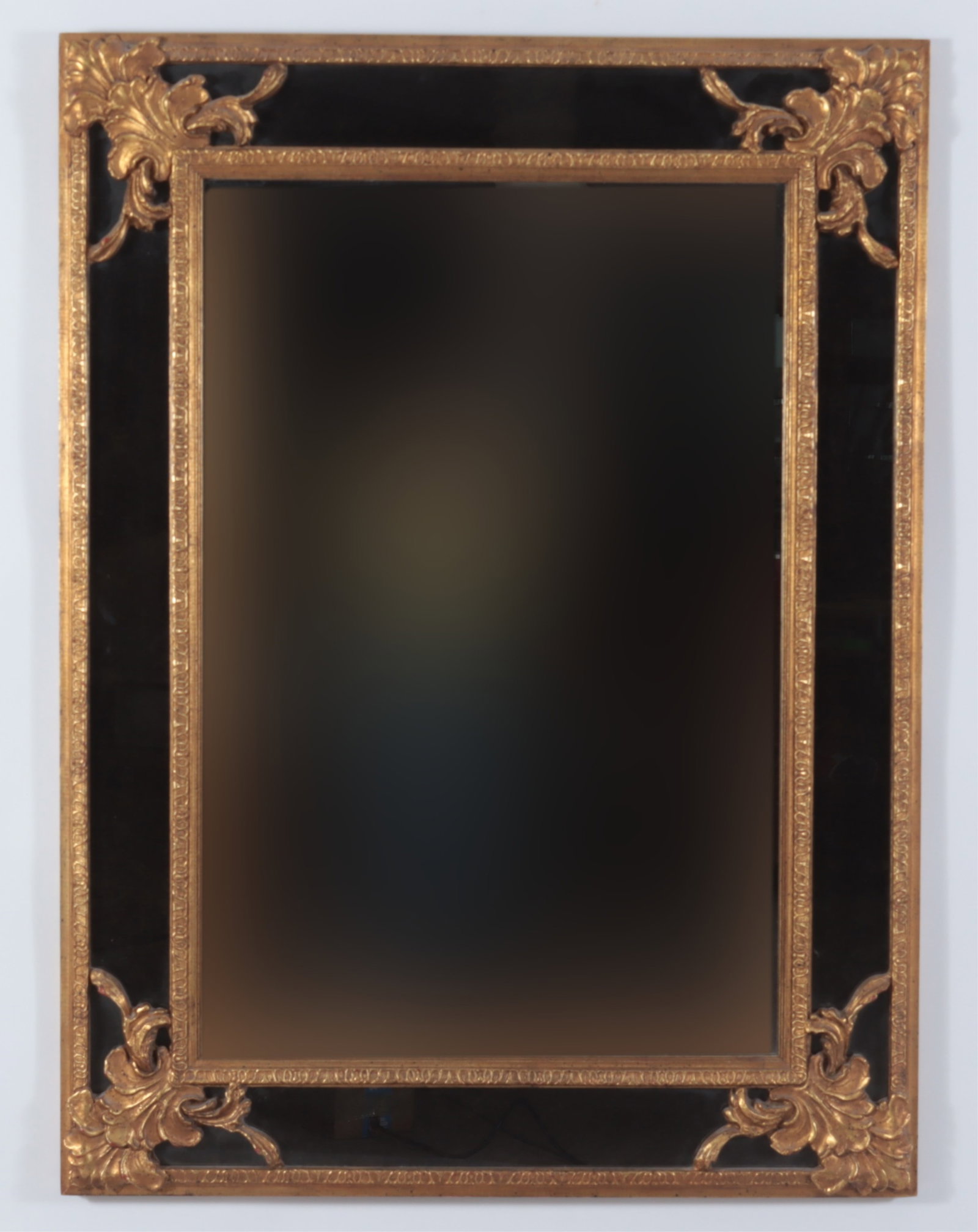 Louis XV Style Giltwood Mirror: Louis XV style rectangular mirror with giltwood accents over smoked glass edge. Dimensions: 47.75" H x 35" W Property from a Bronxville Estate.
