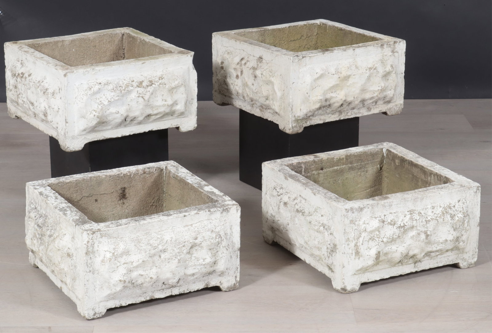 Four Rusticated Cast Cement Planters: A set of four matching square rusticated cast cement planters. Dimensions: 9" H x 18" Square