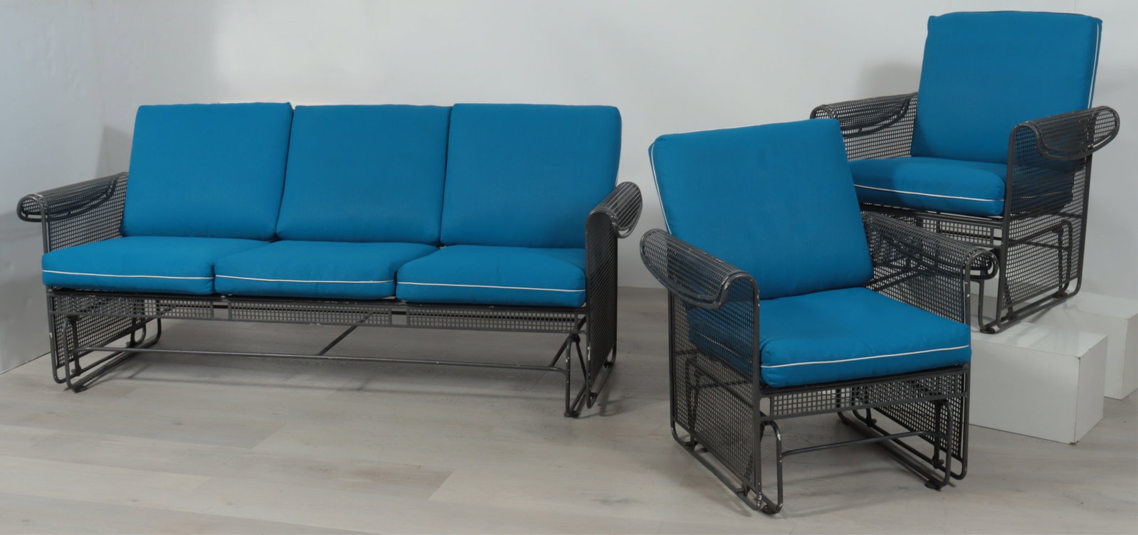 Russell Woodard Iron Gliding Furniture: Russell Woodard Grey Painted Iron Gliding Seat Furniture, sofa, pair of armchairs, upholstered in blue fabric Dimensions: Armchairs 34.5" H x 25" W x 29" D