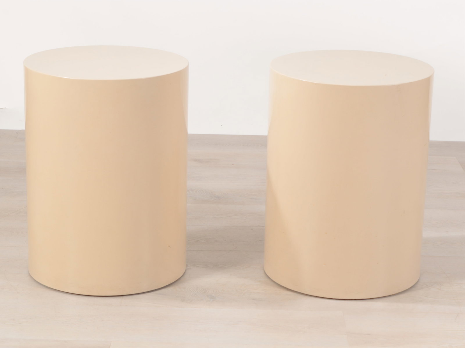 Pair of Contemporary Lacquered Tables: A pair of Index Furniture beige lacquered occasional tables, circa 1970s Dimensions: 24" H x 18" diameter