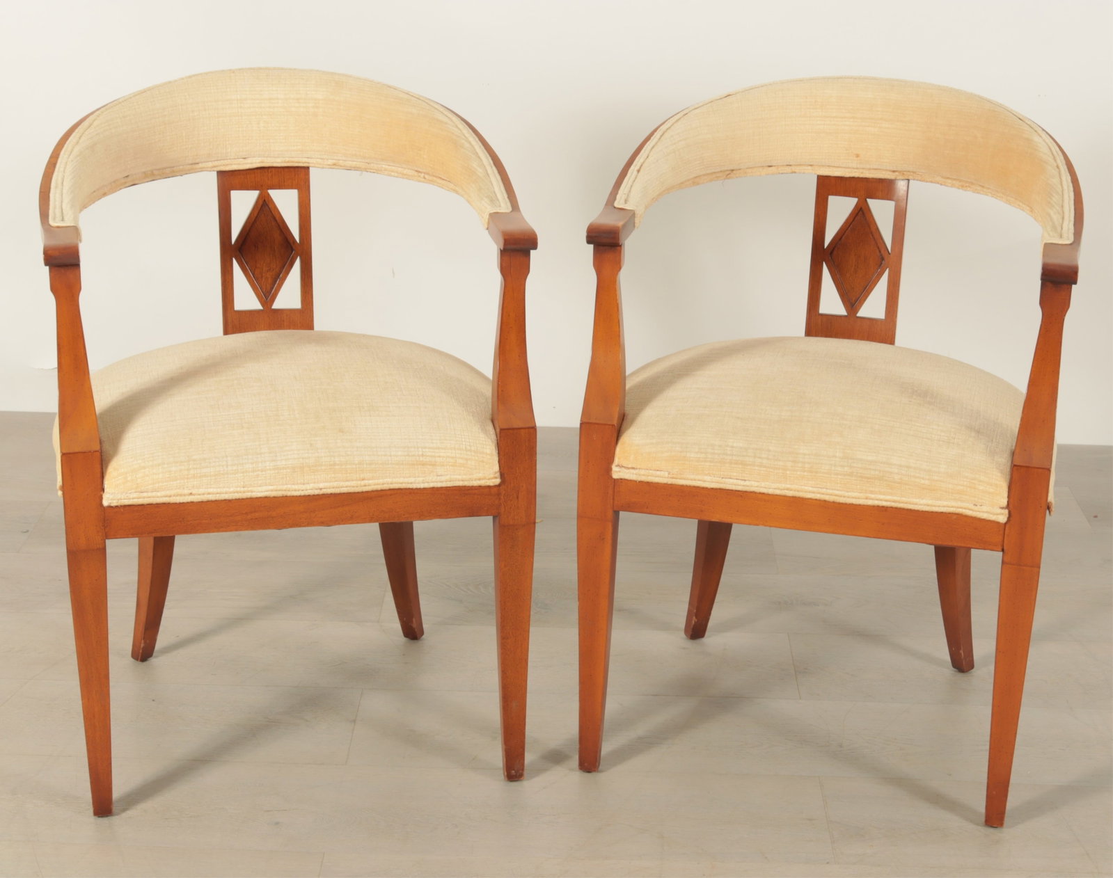 Pair of Classical Style Cherry Armchairs: A pair of classical style cherry frame armchairs upholstered in beige velour. Dimensions: 32.75" H x 23" W x 21" D Property from a Mount Vernon, NY estate.