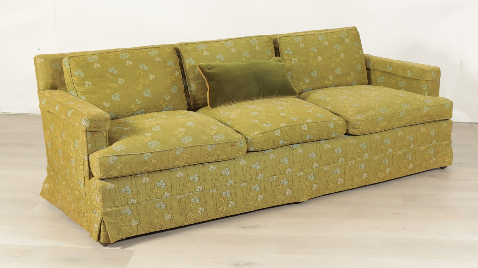 Thomas Pizzillo & Sons Upholstered Sofa: A mid-century modern green foliate upholstered three seat sofa by Thomas Pizzillo & Sons. Dimensions: 29" H x 84" W x 33" D Property from a Mount Vernon, NY estate.