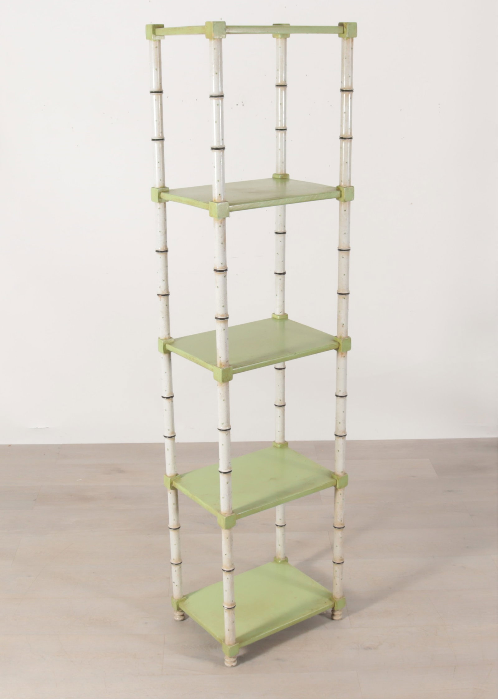 Regency Style Faux Bamboo Etagere: A regency style cream and green painted faux bamboo etagere. Dimensions: 75.5" H x 18.5" W x 14" D Property from a Mount Vernon, NY estate.