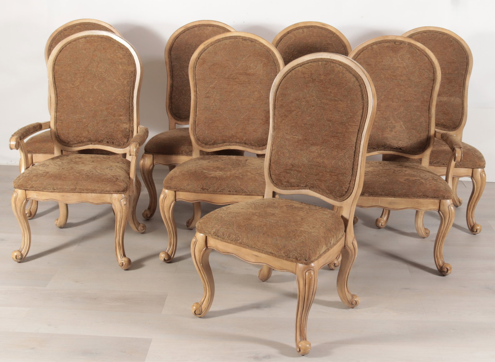 8 Rococo Style Dining Chairs: A group of eight cream painted rococo style dining chairs by Bassett Mirror Co. Including pair of armchairs and six side chairs upholstered in chenille faux tapestry. Dimensions: 45.5" H x 25" W x