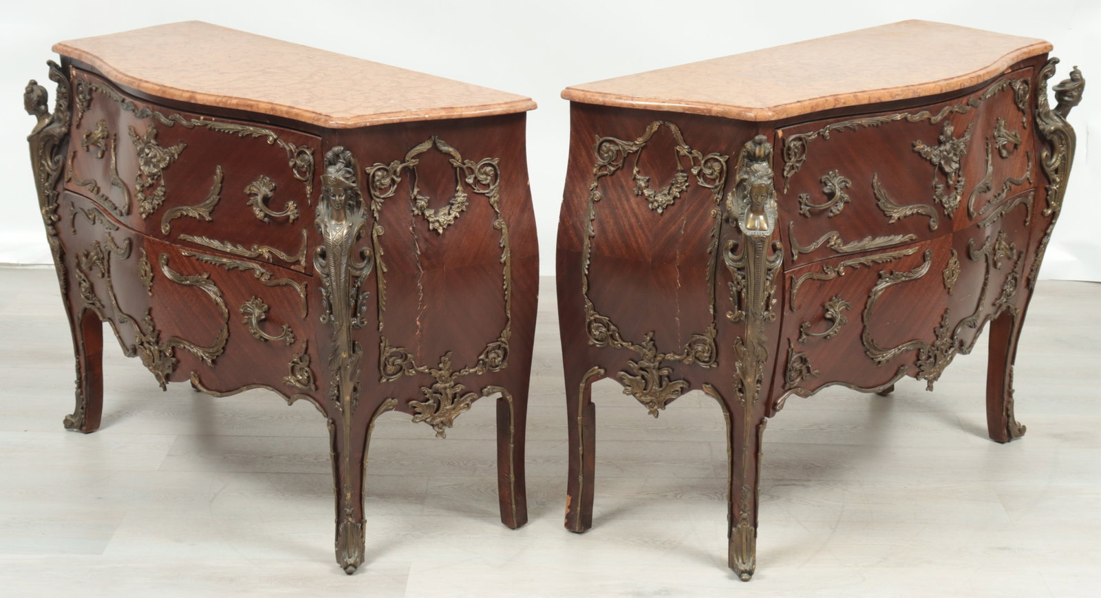 Louis XV Style Commodes: Pair Louis XV Style Brass Mounted Mahogany Commodes Dimensions: 35.5" H x 48.5" W x 20.5" D Property from a Bronxville Estate.