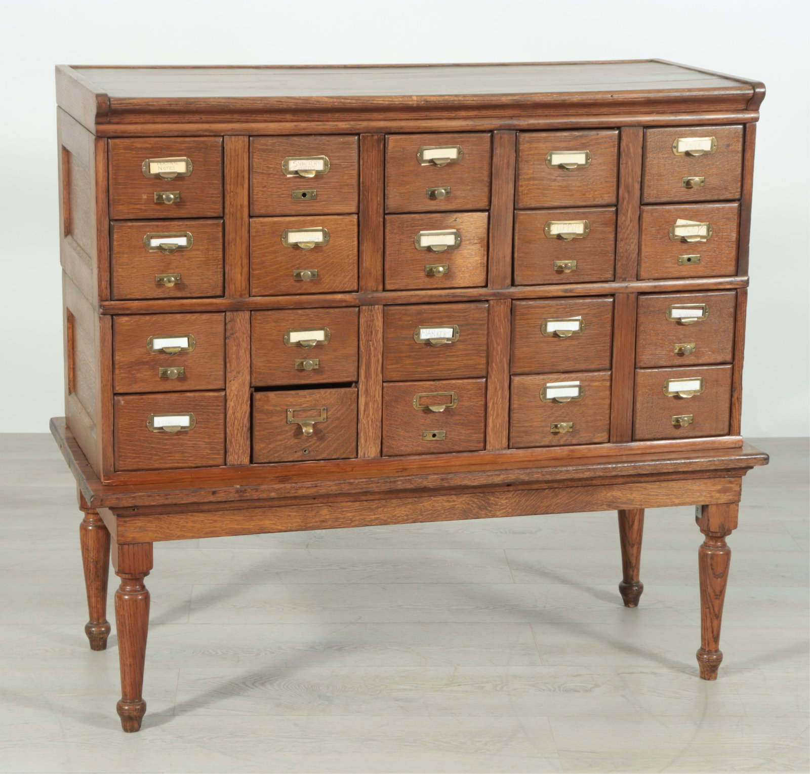 American Oak Card File Cabinet: American Oak Card File Cabinet. Two upper sections on open legged stand. Dimensions: 39.5" H x 44" W x 19.5" D Property from a Mount Vernon, NY estate.
