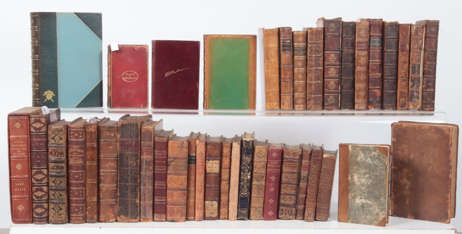 40 Antiquarian Leather Bound Books: A group of 40 Antiquarian Leather Bound Books, including: A. WEIGALL. The Life and Times of Cleopatra. Garden City, NY: 1924. Contemporary blue half morocco gilt. Dimensions: Smallest 3.875" x 5.875"L