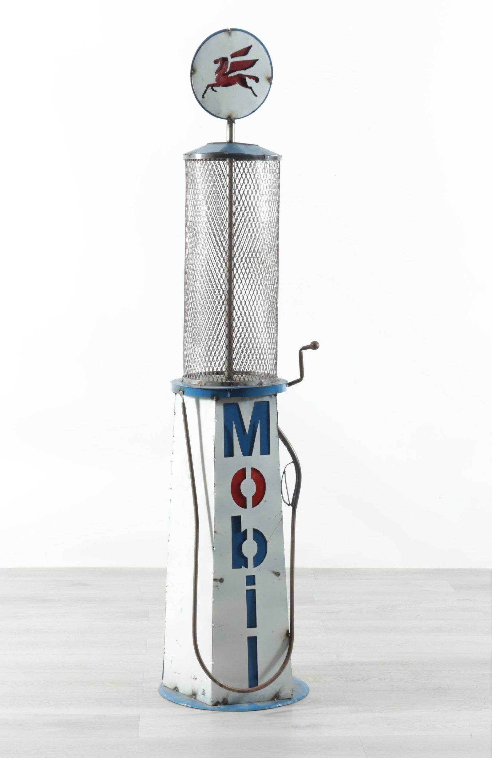 Antique Mobil Gas Pump: A large antique Mobil painted metal gas pump.