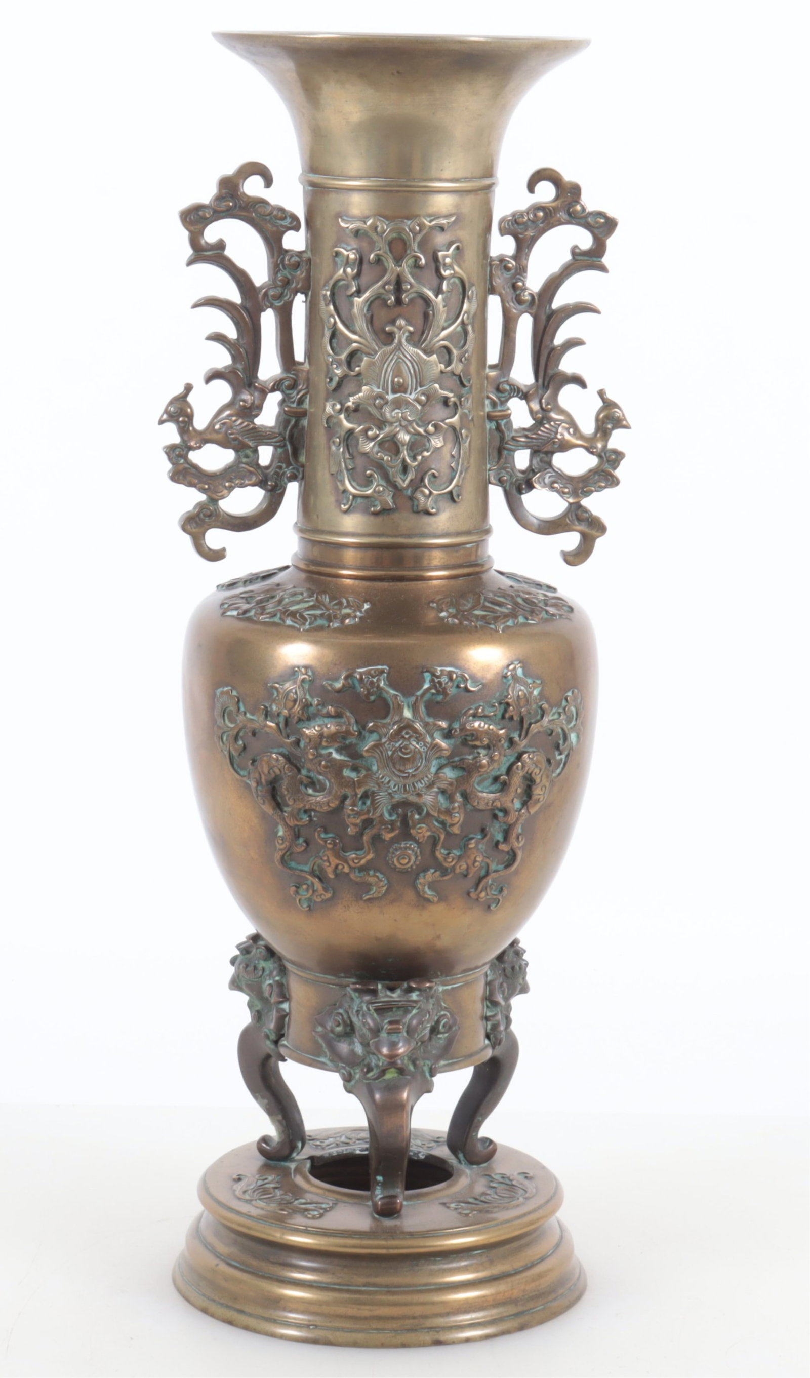 Japanese Meiji Period Bronze Vase: Japanese Meiji period bronze vase with stylized aviary handles, dragon and floral relief decorations, ornamental mythical creatures winged feet