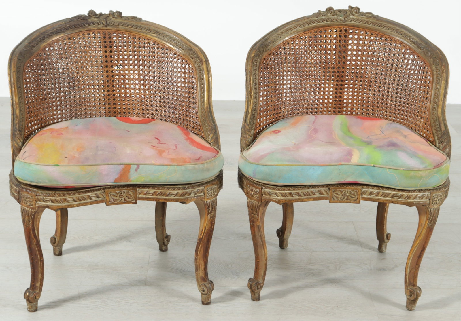 Pair Louis XV Style Giltwood Caned Slipper Chairs: Pair Louis XV Style Giltwood Caned Slipper Chairs, Early 20th C., in printed cotton upholstery