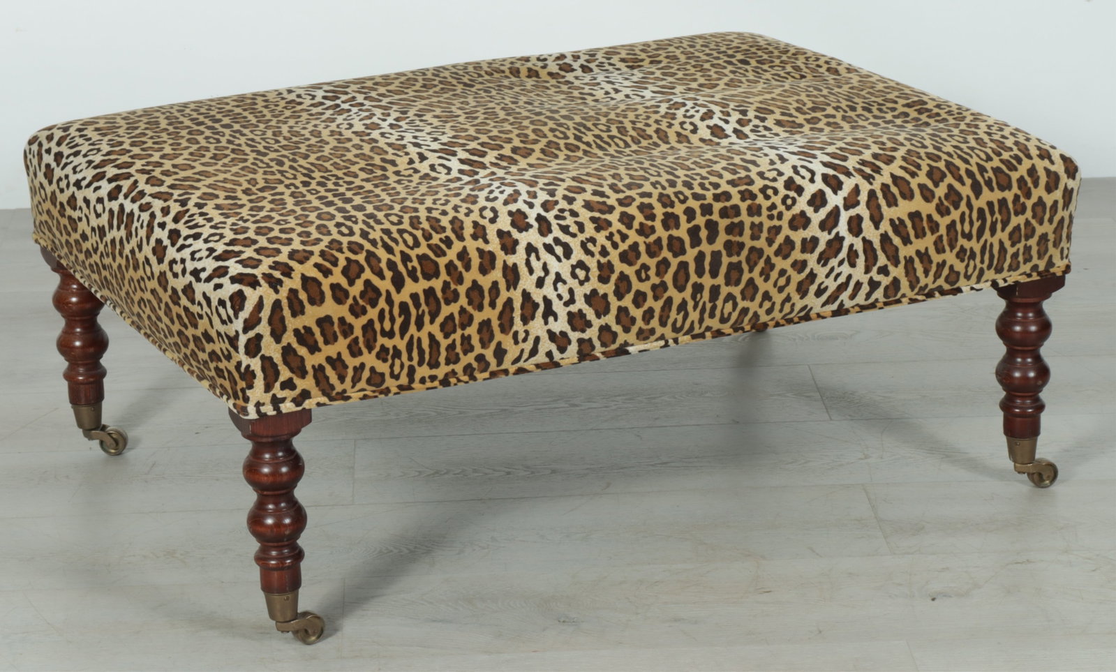 George Smith Style Ottoman: George Smith style ottoman upholstered in velvet leopard print, wood turned legs