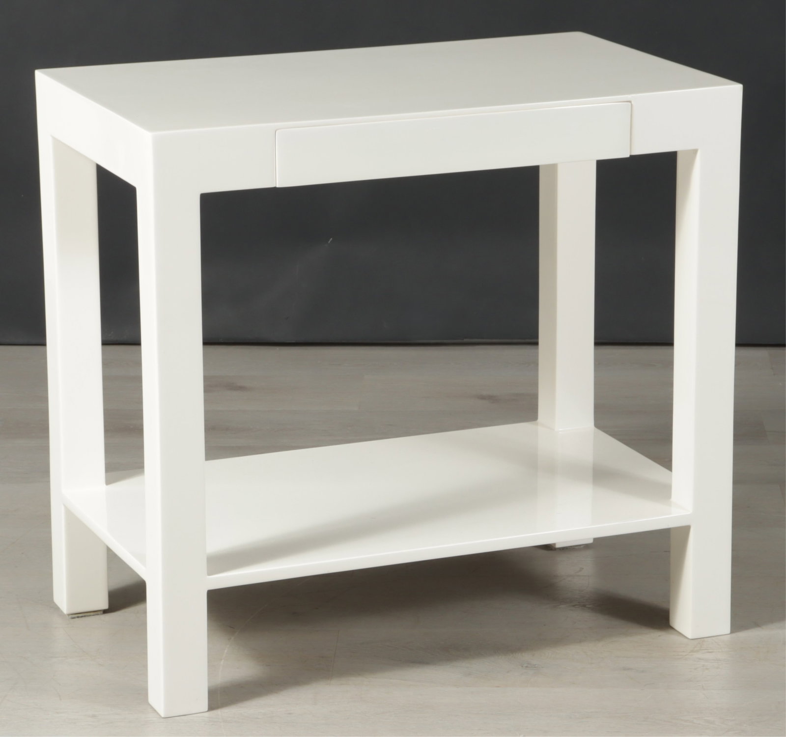 White Lacquer Side Table: White lacquer side table with lower-tier and a concealed frieze drawer lined with cream leather.