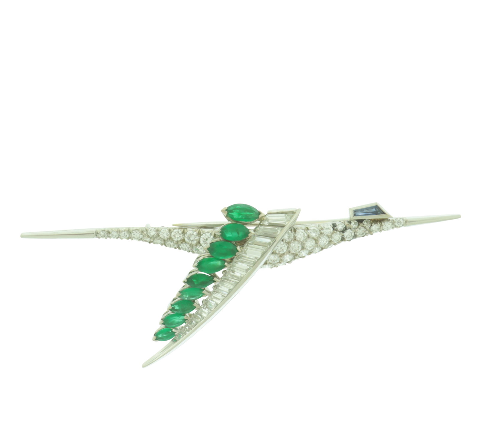 Diamond and Emerald Crane Brooch: A vintage 18 karat white gold brooch in the form of a crane with tapered baguette cut sapphire eye, body comprising approximately 44 round brilliant pave diamonds, wing comprised of 11 marquis cut