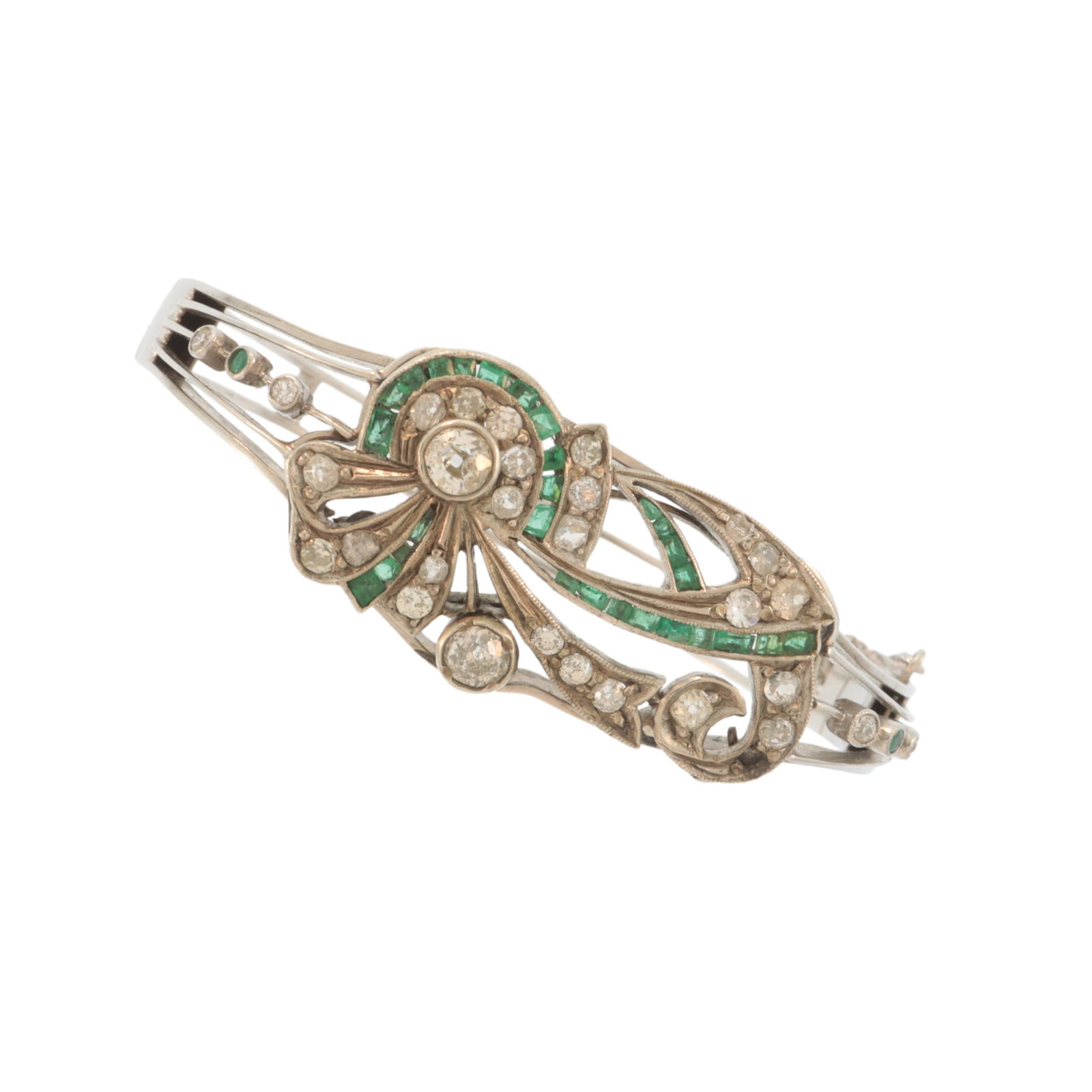 Art Nouveau Diamond and Emerald Bracelet: Art Nouveau 14 karat white gold bangle bracelet set with diamonds and emeralds, early 20th century. Two largest old European cut diamonds weighing approximately 0.25 ct each, adorned with 32
