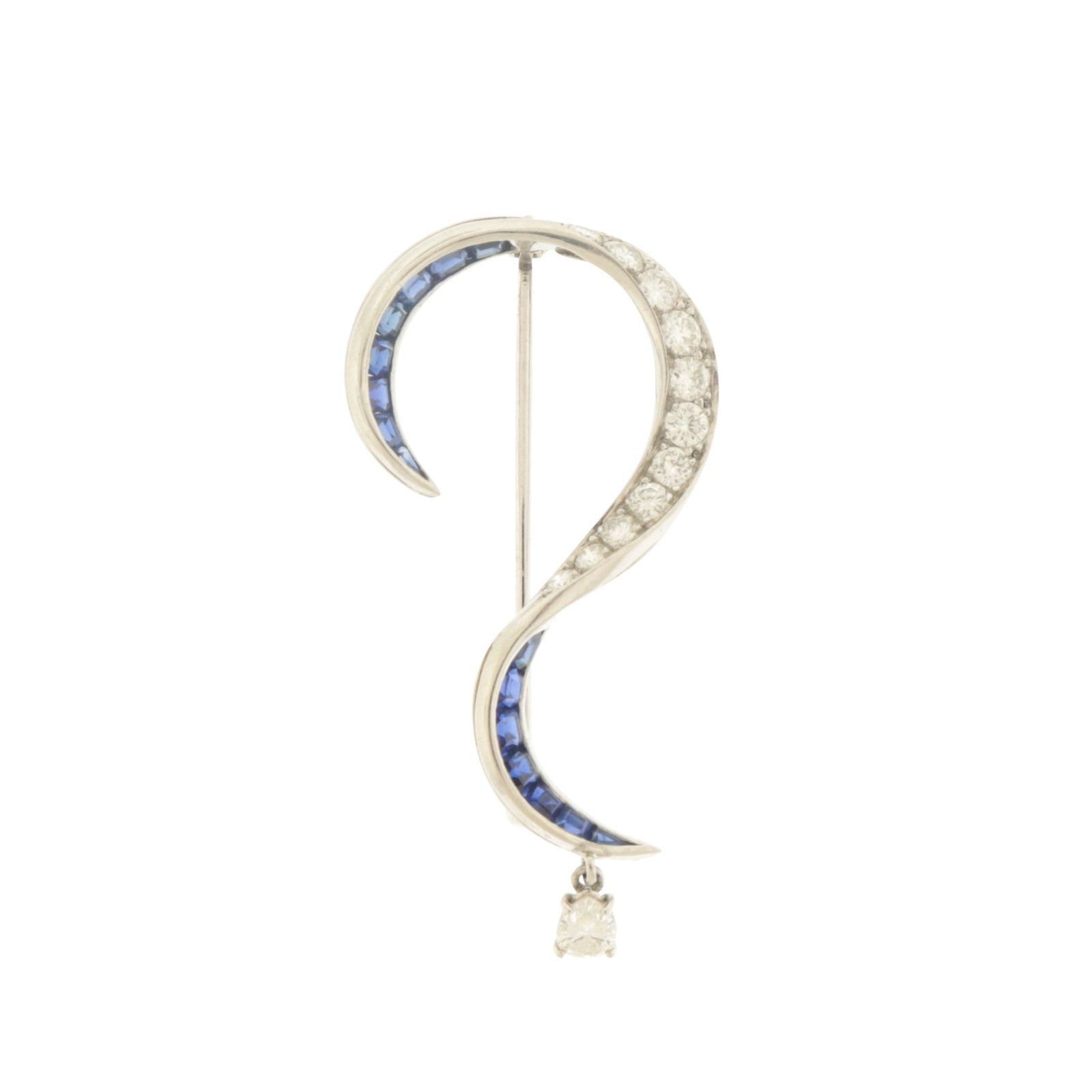 Diamond and Sapphire Question Mark Brooch: Vintage 18 karat white gold brooch in the form of a question mark, adorned with 15 square cut channel set sapphires and 11 round brilliant cut pave set melee diamonds, terminating in one dangling pear