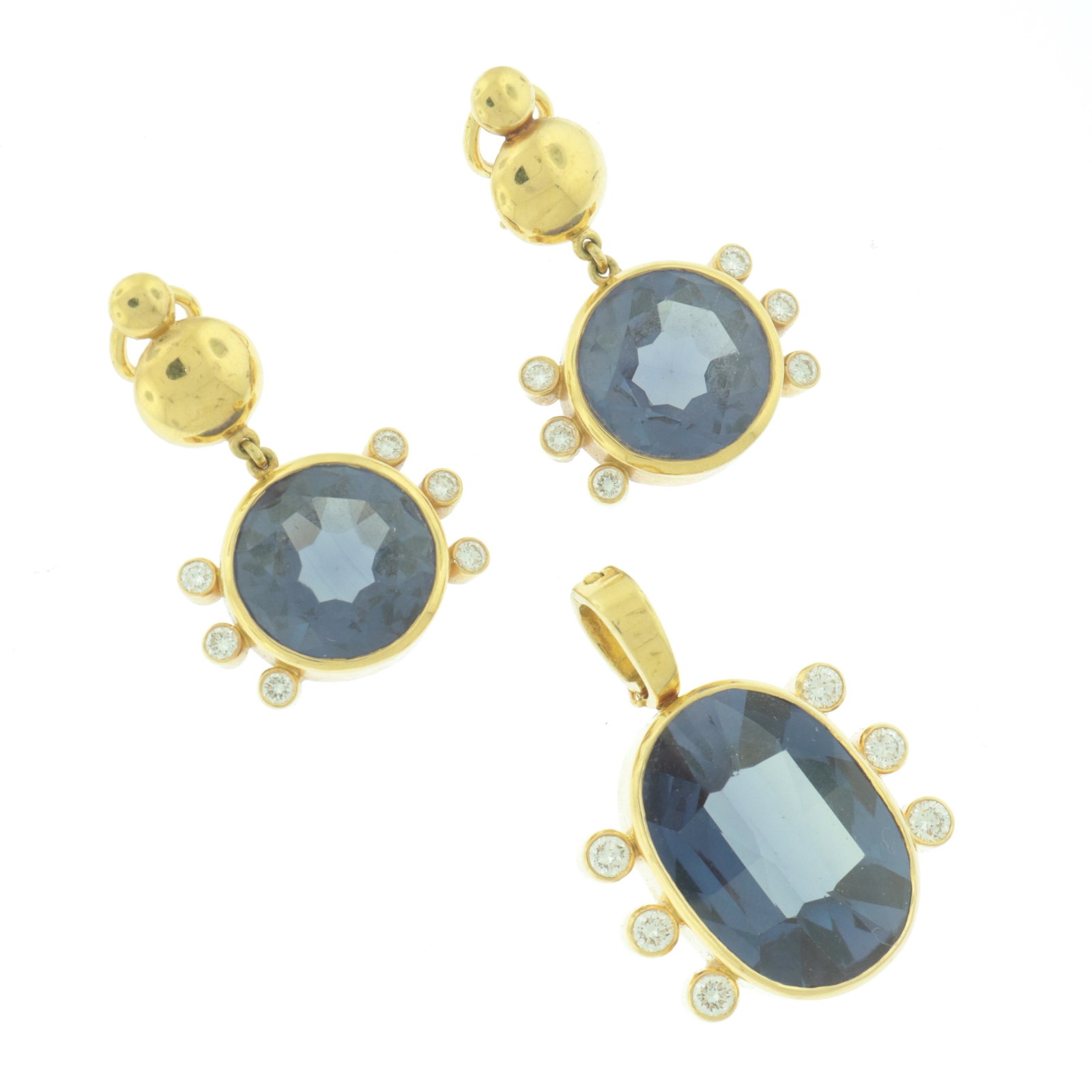 18K Yellow Gold and Alexandrite Earrings & Pendant: Pair of earclips each with ~2.5 ct round natural cut synthetic Alexandrite flanked by six bezel set round brilliant cut diamonds, housed in 18 karat yellow gold, with ~21 ct matching pendant. Stamped
